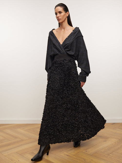 3D Rose Petal A-Line Maxi Skirt in Black — worn with a black wrap top