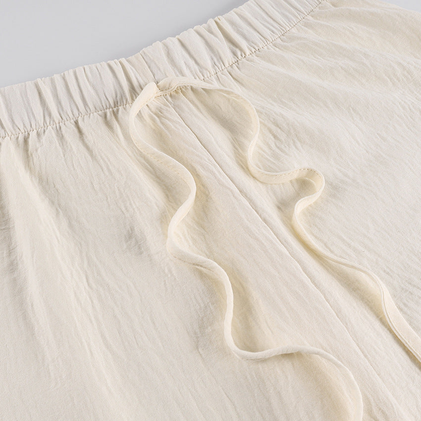 Ruffle Tie-Front Blouse and Wide-Leg Pants Set in Cream — close-up of the drawstring waist