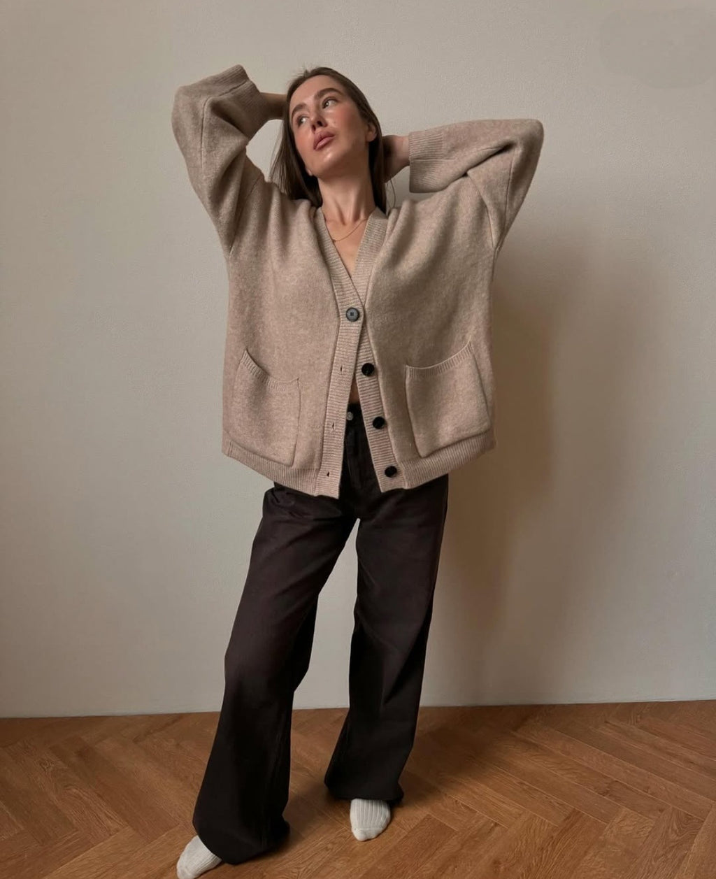 Oversized V-Neck Button Cardigan with Pockets in Khaki — front view on model