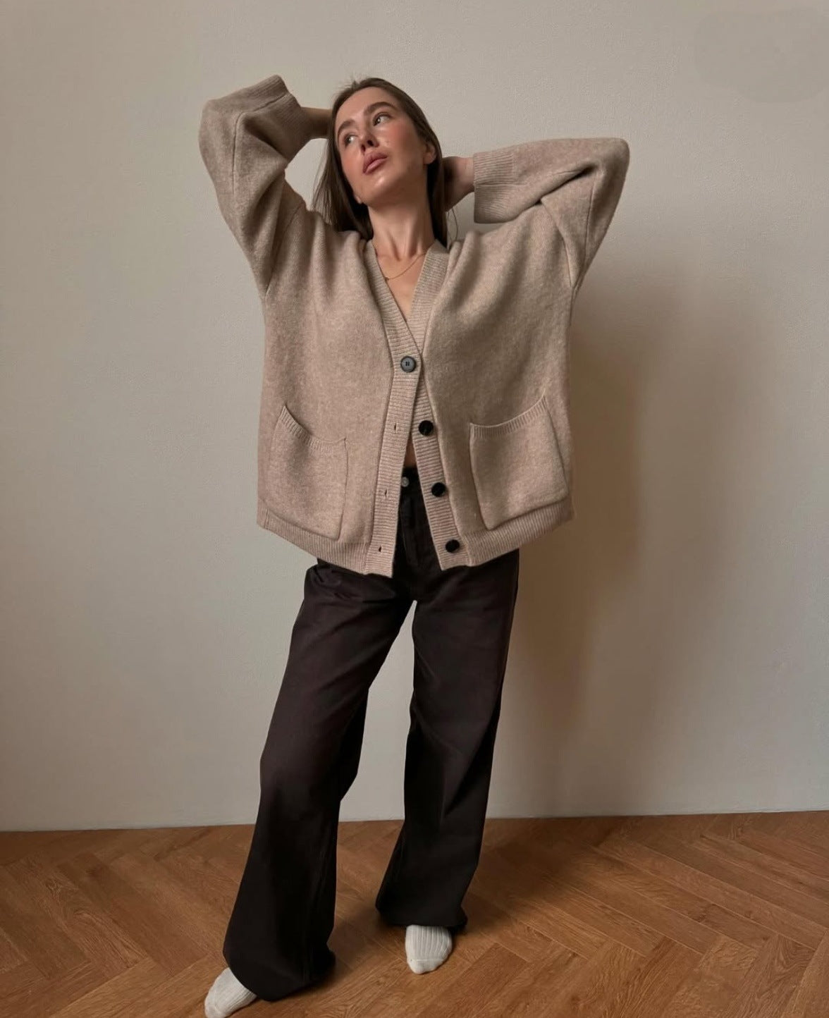 Oversized V-Neck Button Cardigan with Pockets in Khaki — front view on model