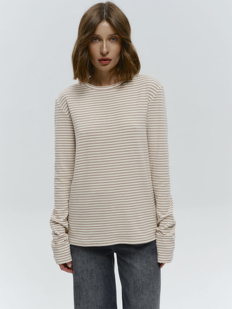Striped Cotton Crew Neck Long Sleeve Tee in Oat Stripe — on model with jeans