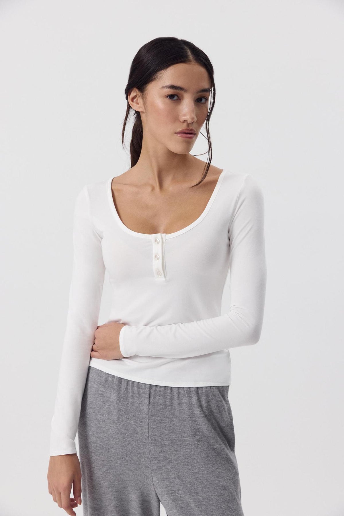 Modal Scoop Neck Button Long Sleeve Tee in White — front view with button placket