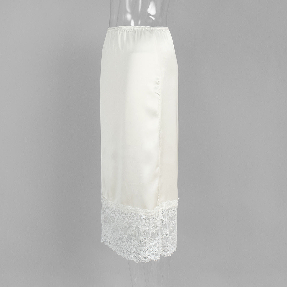 Satin Midi Skirt with Lace Hem in Ivory — side view on mannequin