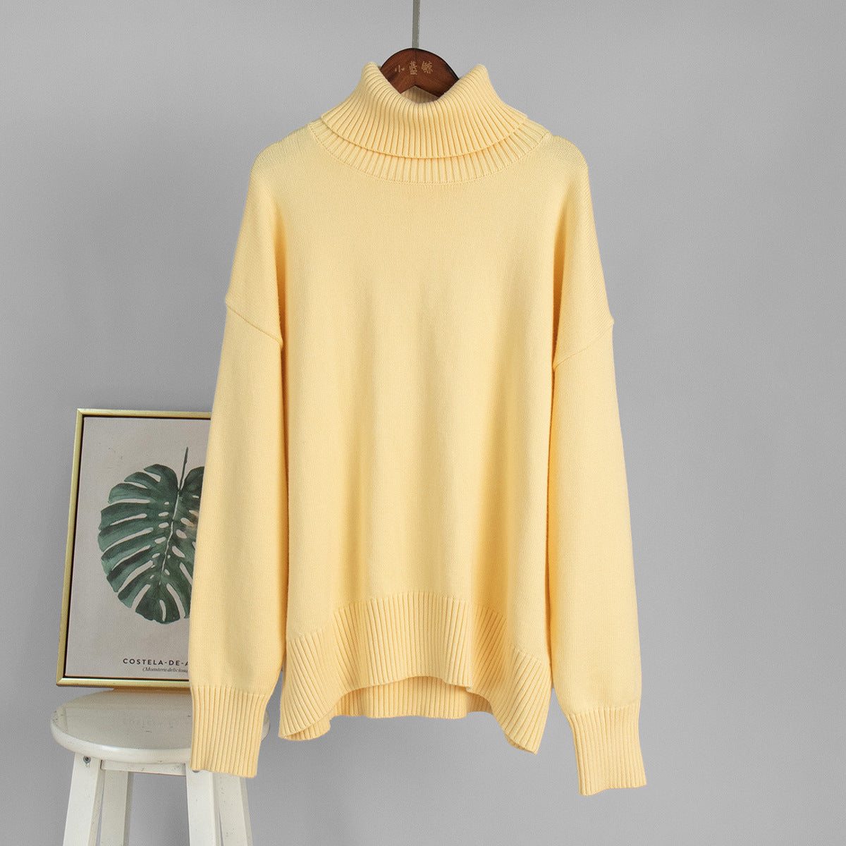 Oversized Knit Turtleneck Sweater in Butter Yellow — front view