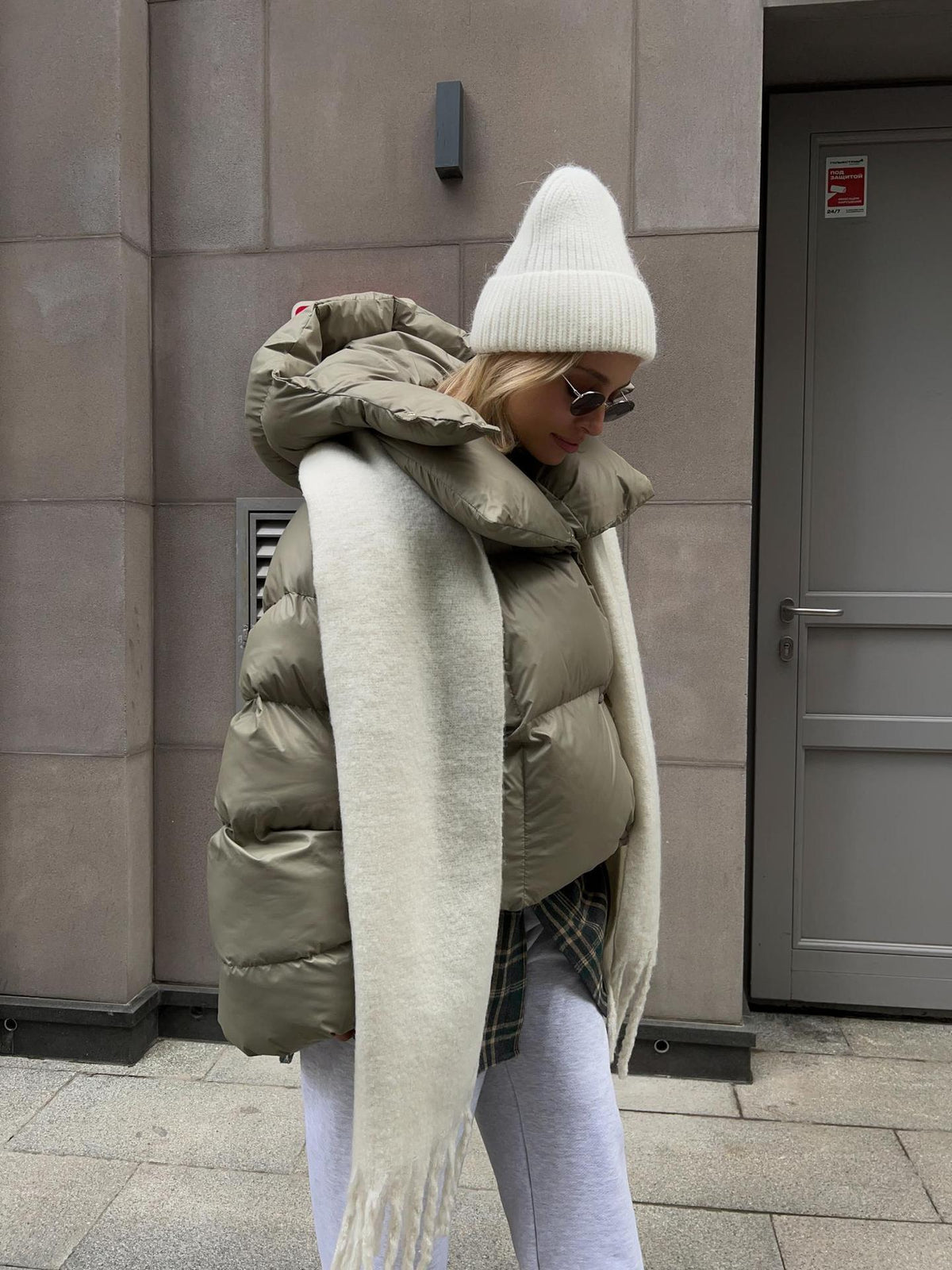 Cropped Hooded Puffer Jacket with Drawstring Hem in Sage Green — front view on model
