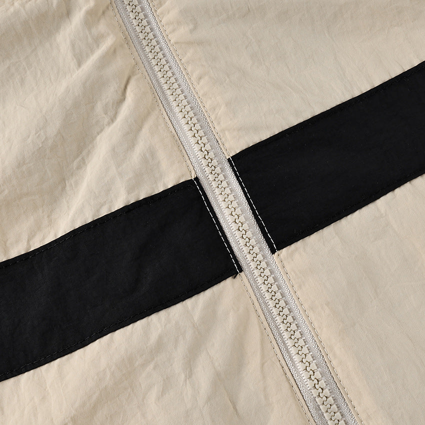 Contrast-Stripe Stand-Collar Track Jacket in Stone — close-up of the zip and stripe