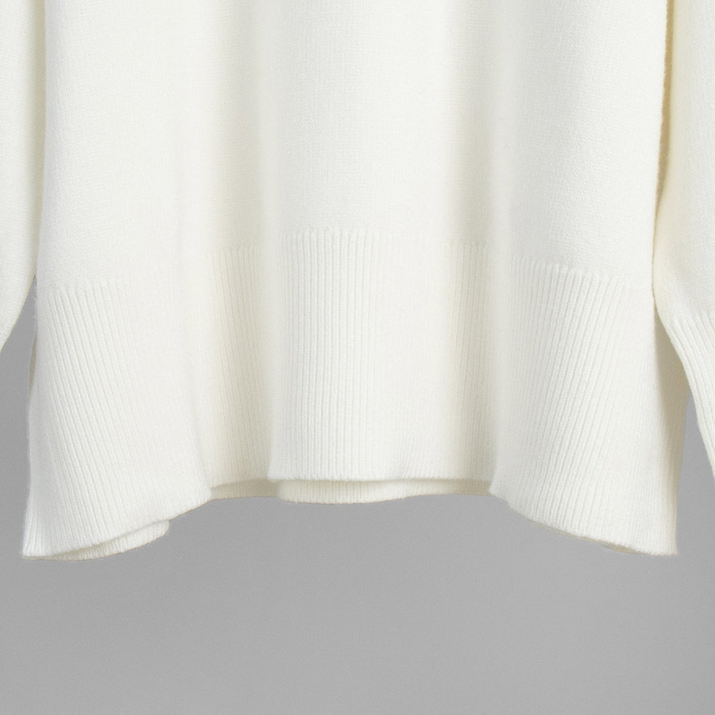 Slouchy Oversized Crew Neck Sweater in Ivory — close-up of the ribbed hem