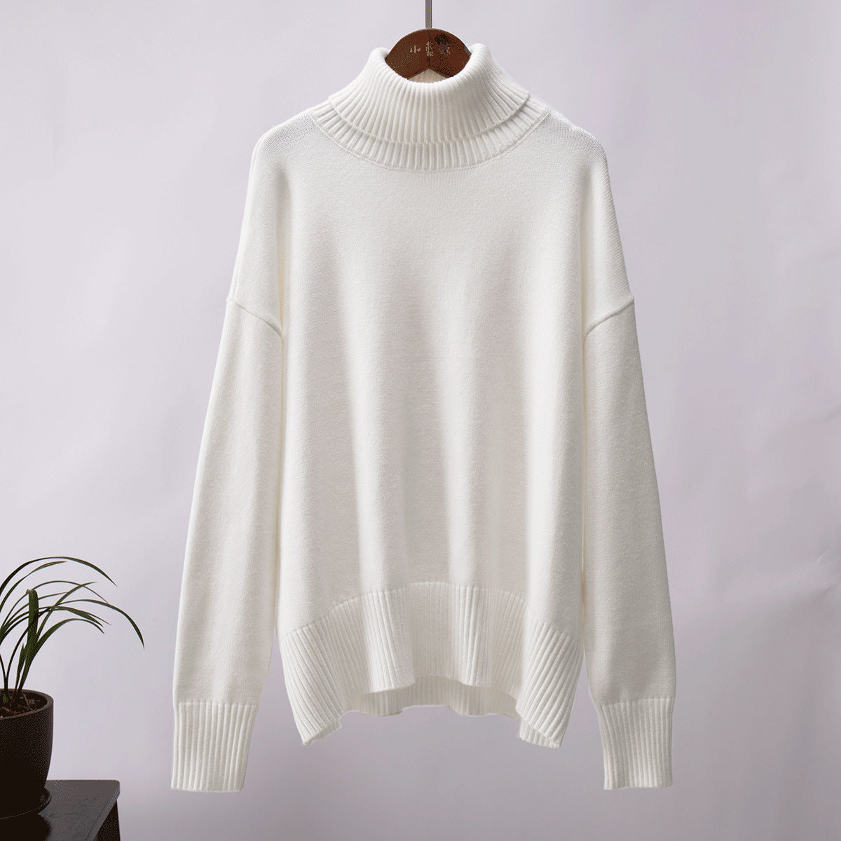 Oversized Knit Turtleneck Sweater in Ivory — front view