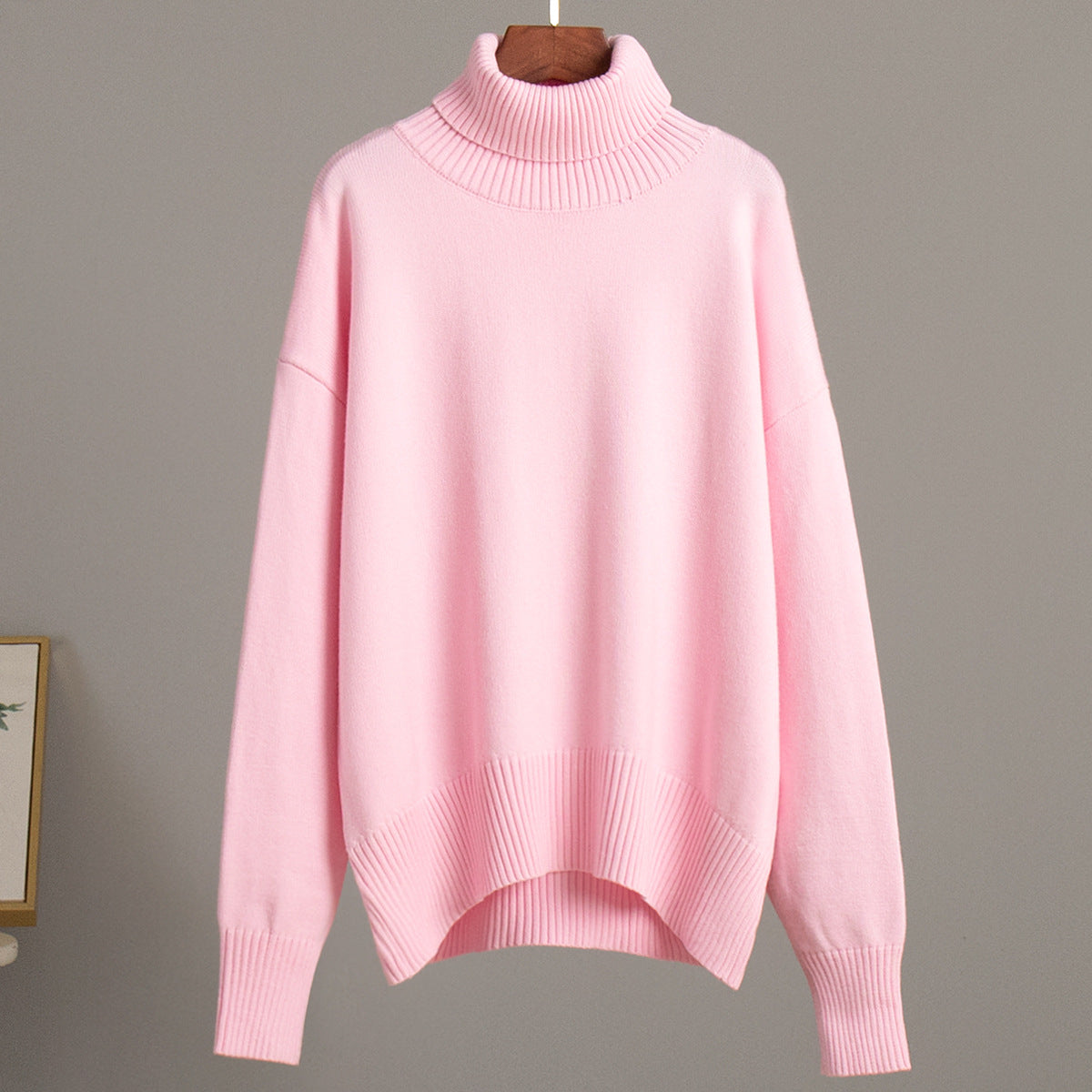 Oversized Knit Turtleneck Sweater in Baby Pink — front view
