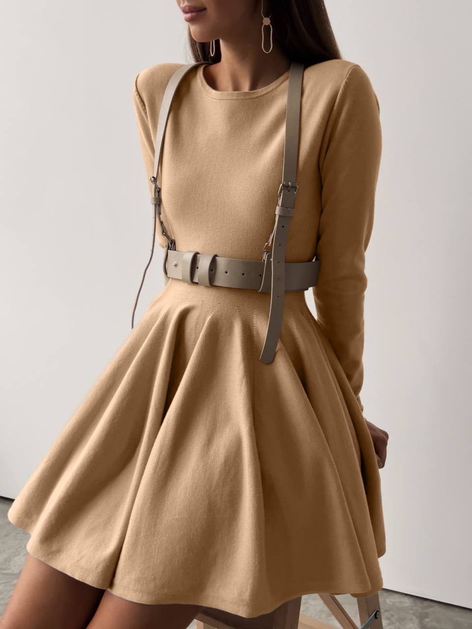 Fitted Knit Skater Mini Dress with Long Sleeves in Camel — front view on model, shown with a harness belt (not included)