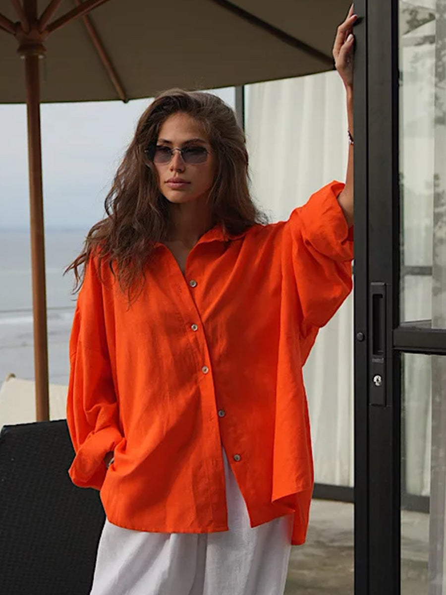 Relaxed Cotton Button-Down Shirt in Tangerine — front view on model