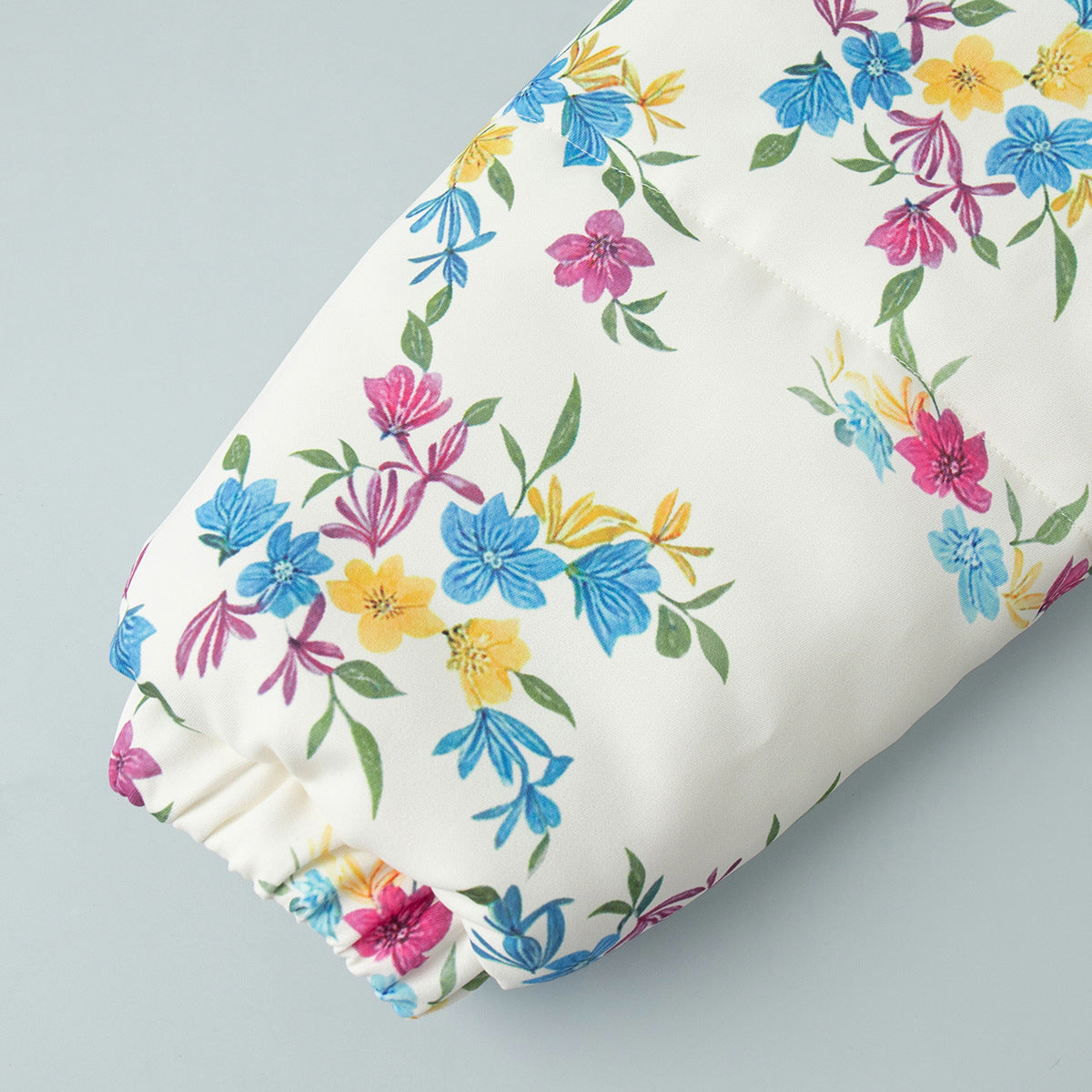Floral Print Puffer Jacket with Stand Collar in Cream Floral — close-up of the gathered cuff