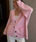 Oversized V-Neck Button Cardigan with Pockets in Pink — close view on model