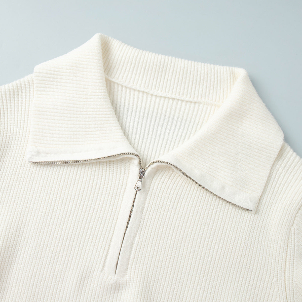 Half-Zip Polo Knit Sweater & Wide-Leg Pants Set in Ivory — close-up of the half-zip polo collar
