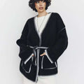 Contrast-Stitch Belted Cardigan in Black — front view on model