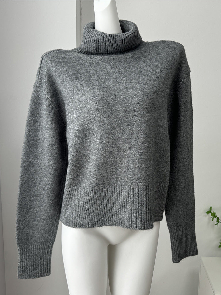 Relaxed High Neck Sweater with Ribbed Cuffs in Charcoal — front view on model or garment