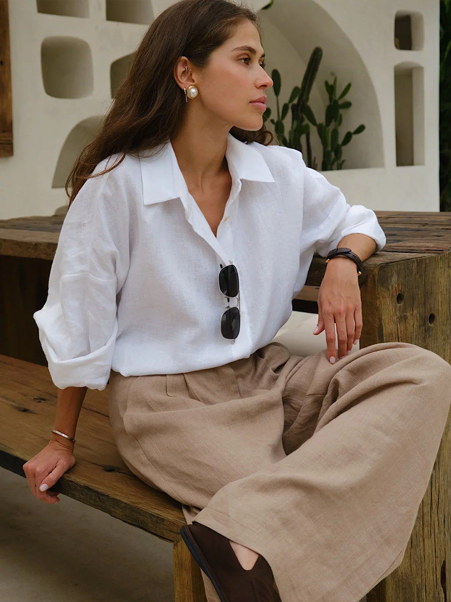 Relaxed Cotton Button-Down Shirt in White — seated, sleeves rolled