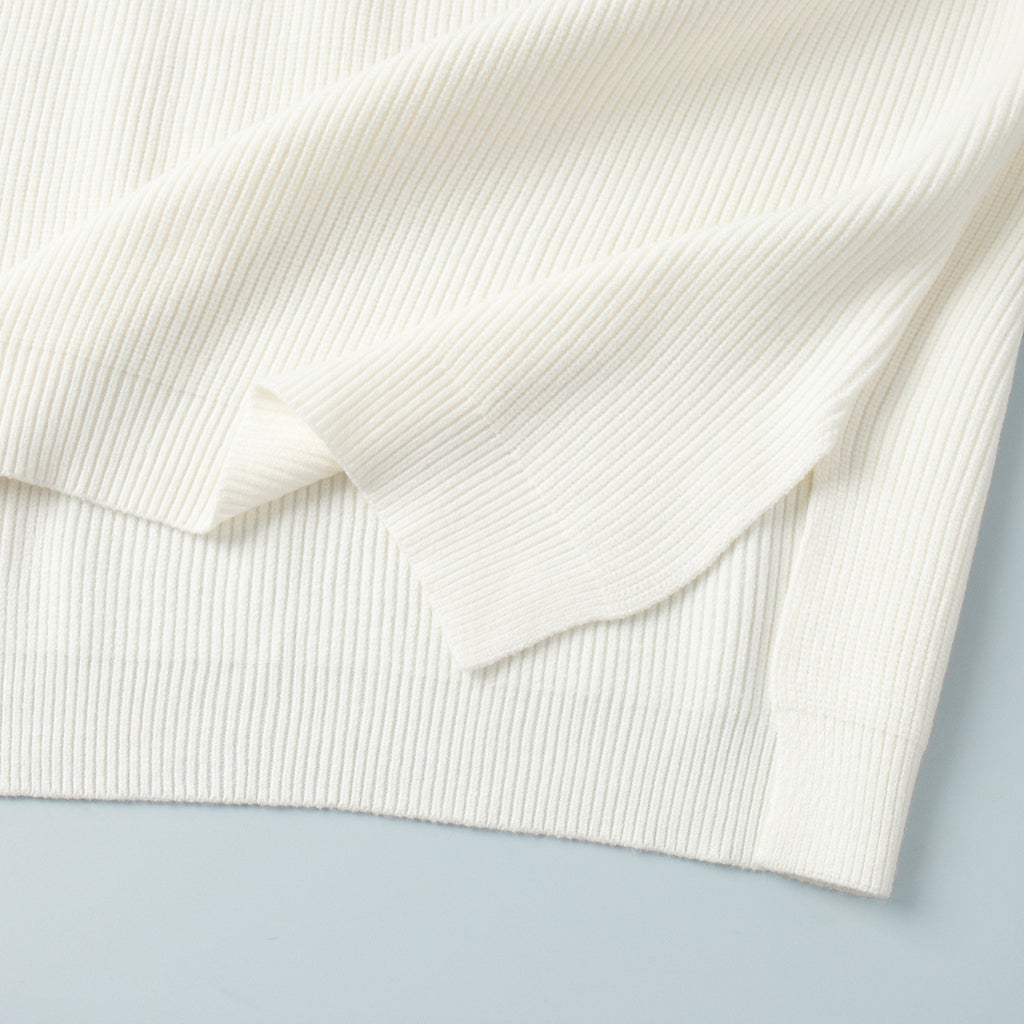 Half-Zip Polo Knit Sweater & Wide-Leg Pants Set in Ivory — close-up of the side slit
