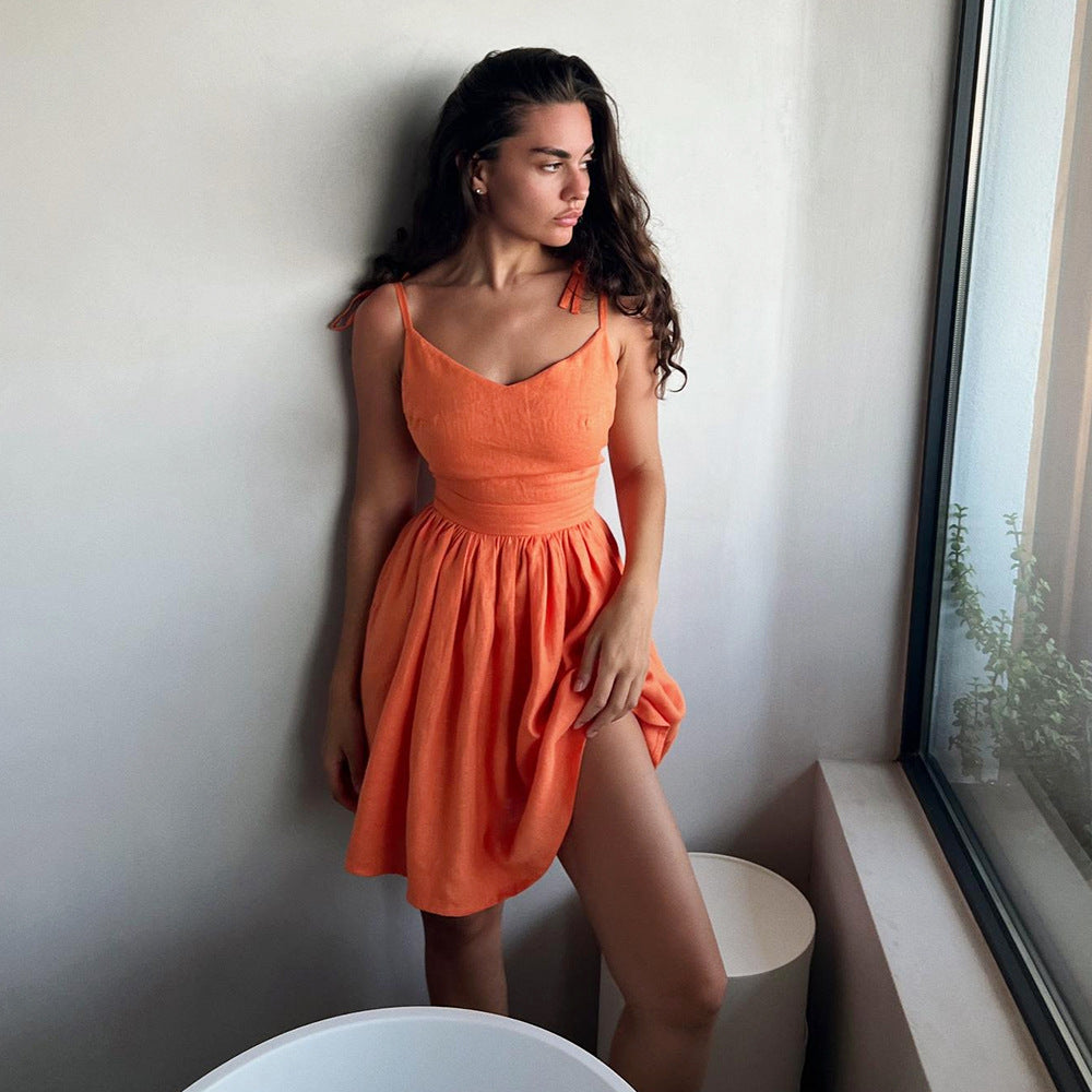 Tie-Shoulder Open-Back Cotton Mini Dress in Bright Orange — front view on model