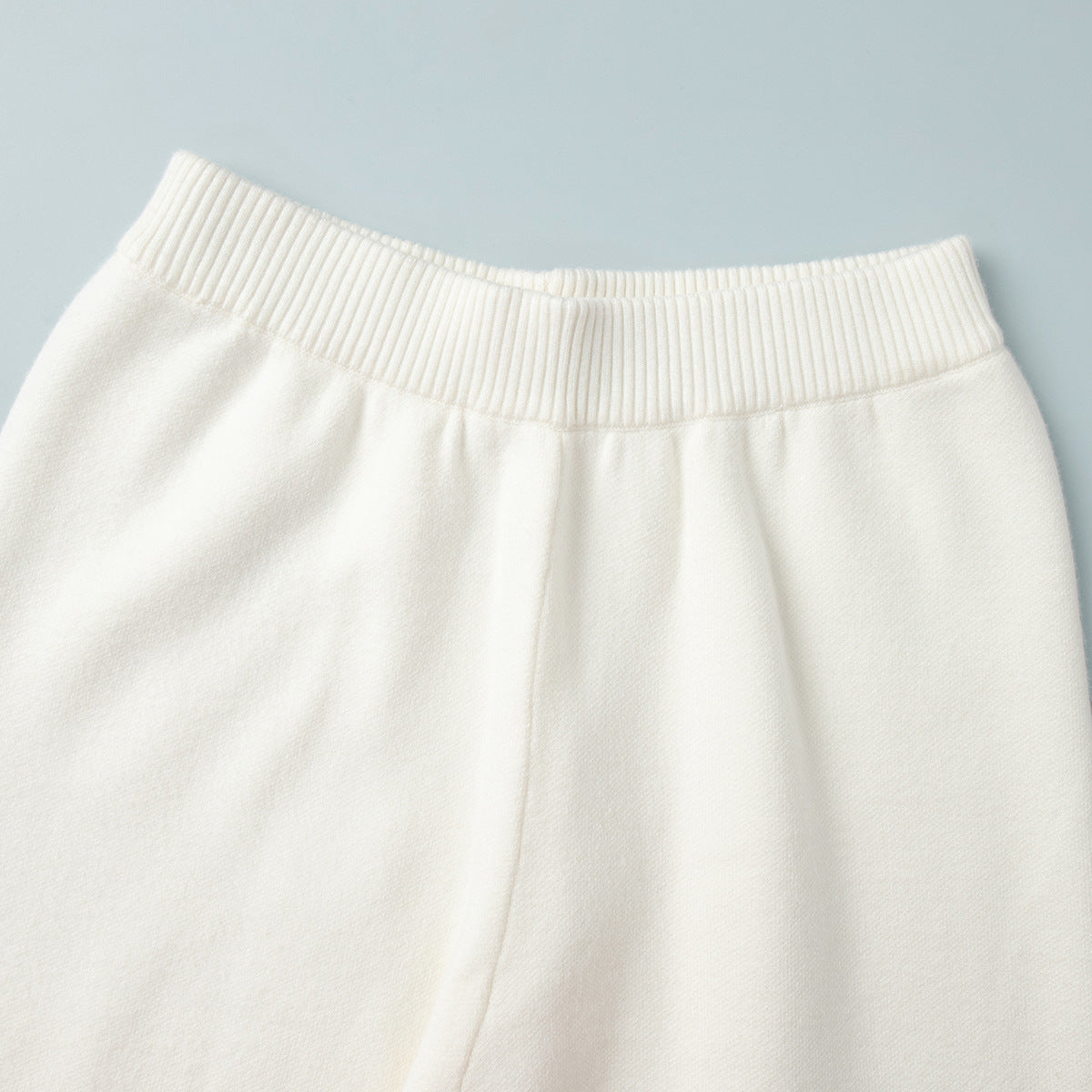 Distressed-Hem Oversized Knit Sweater & Jogger Set in Cream — close-up of the jogger waistband