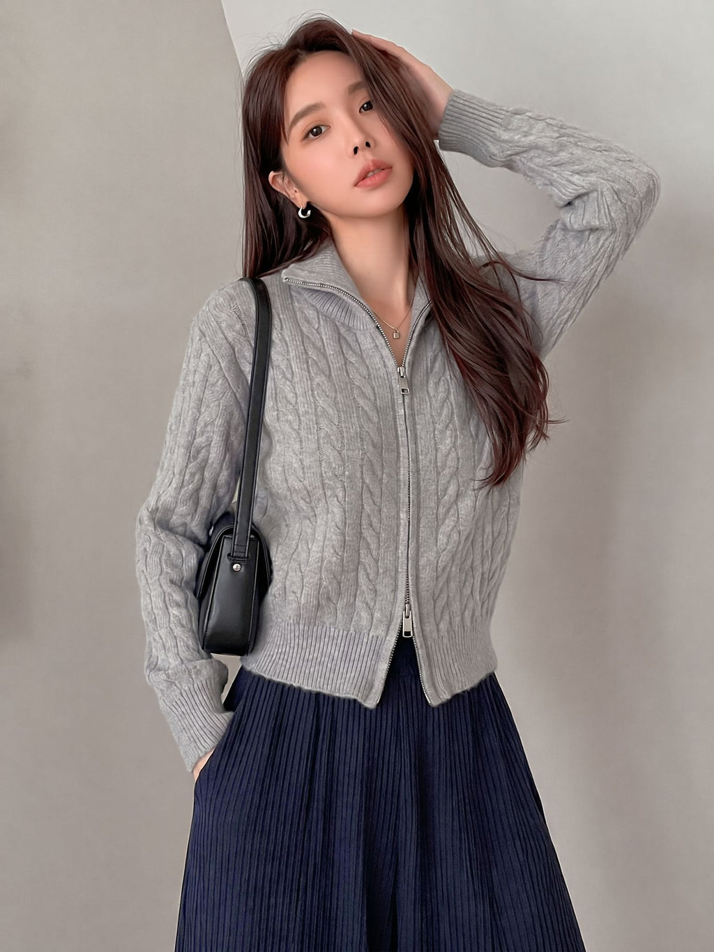 Cable-Knit Zip-Up Cardigan Sweater in Light Gray — front view on model
