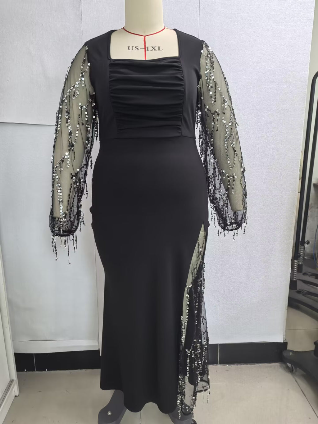 Plus-Size Mermaid Maxi Gown with Sequin-Fringe Mesh Sleeves in Black — front view on mannequin