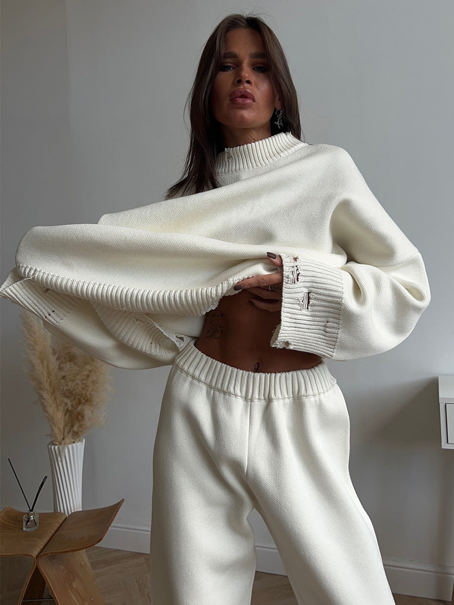 Distressed-Hem Oversized Knit Sweater & Jogger Set in Cream — close-up of the sweater on model