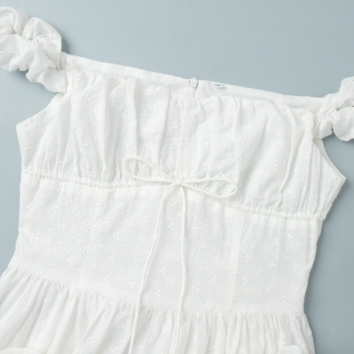 Eyelet Cotton Off-Shoulder Midi Dress in Ivory Eyelet — close-up of neckline and puff sleeve