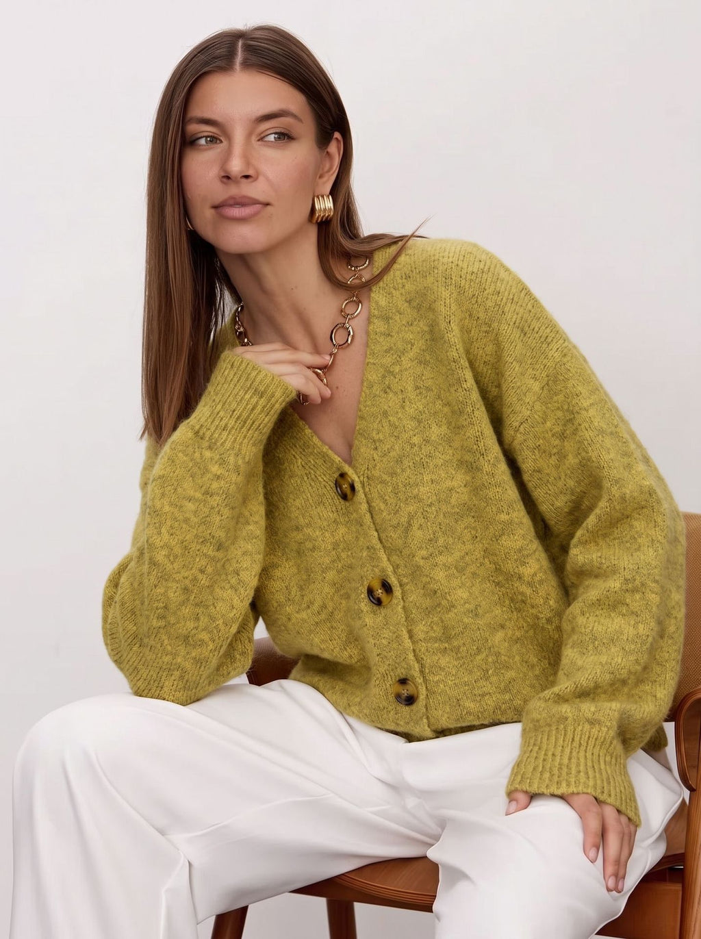 Fuzzy Wool-Blend V-Neck Button Cardigan in Chartreuse — on model, seated