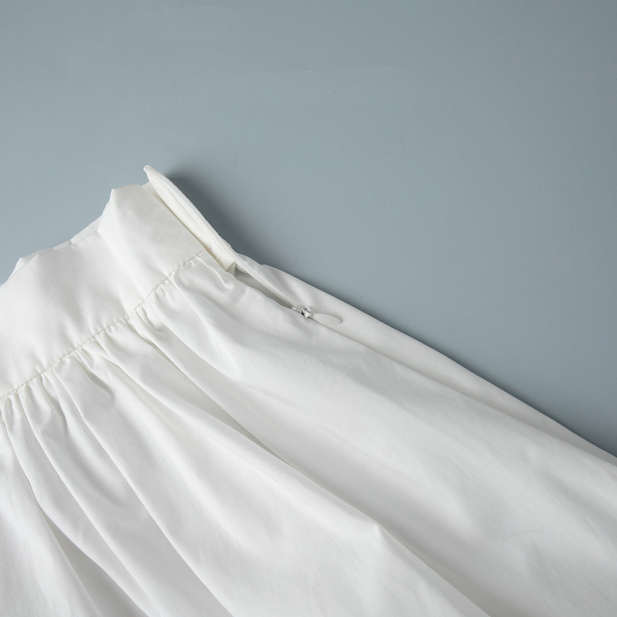 Cotton Crop Camisole & Gathered Maxi Skirt Set in White — close-up of the elastic back waist