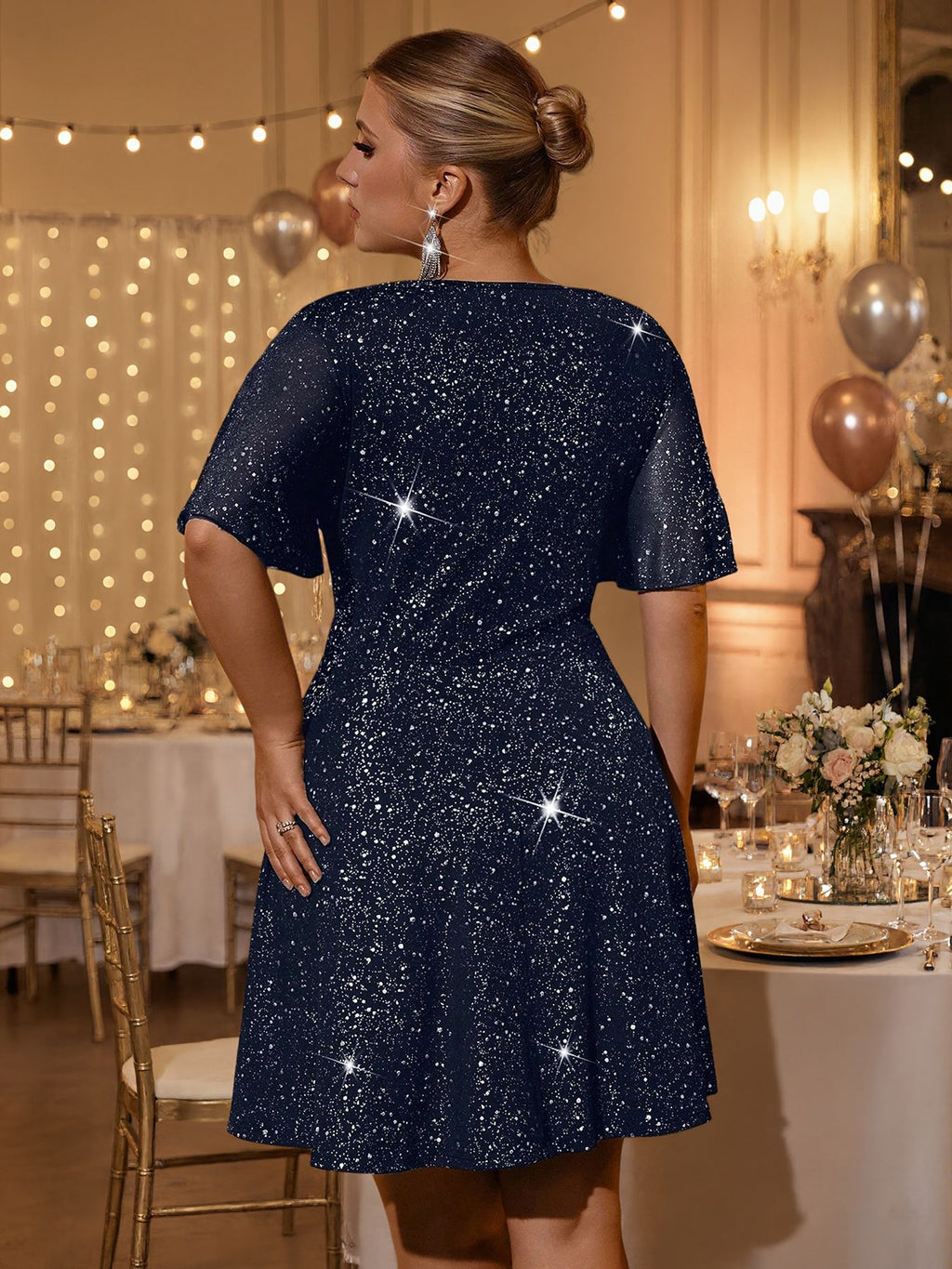 Plus-Size Glitter Wrap-Front Party Dress with Flutter Sleeves in Navy — back view on model