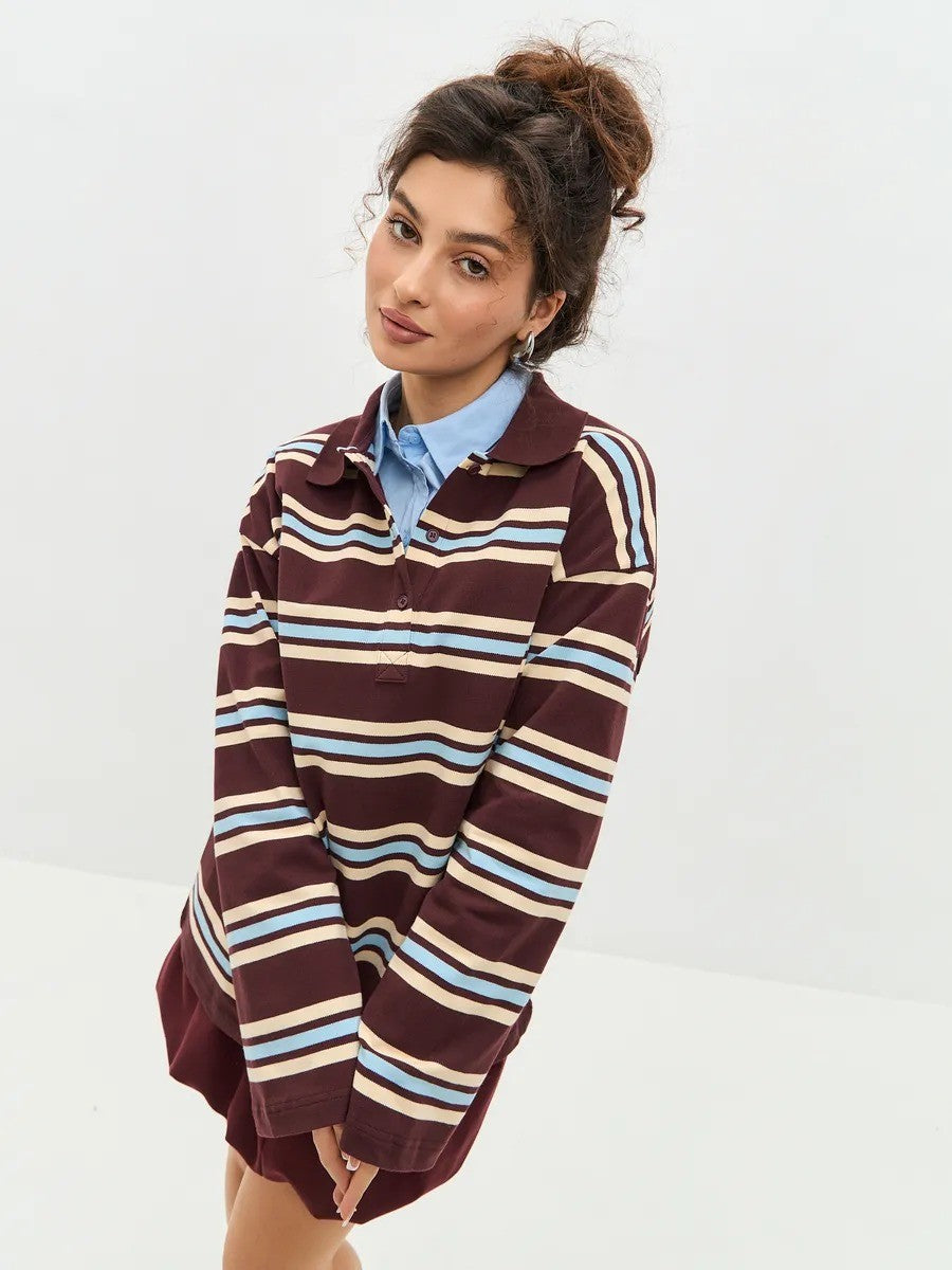 Relaxed Striped Long Sleeve Polo Shirt in Maroon Stripe — front view on model, over a collared shirt