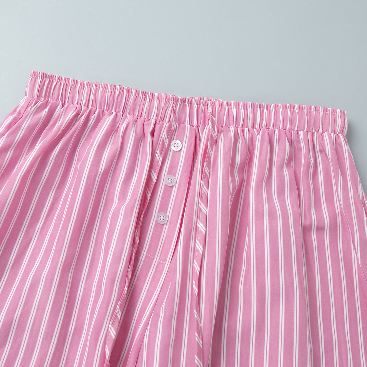 Striped Balloon Harem Pants in Pink Stripe — close-up of the waistband and buttons