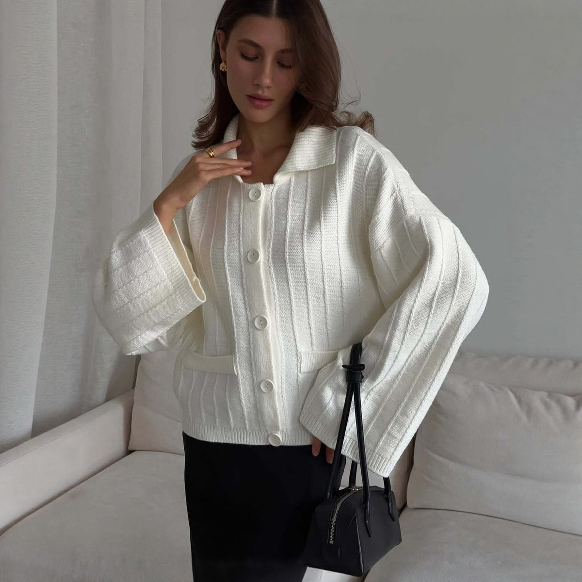 Oversized Collared Button Cardigan with Bell Sleeves in Ivory — on model, showing the bell sleeves