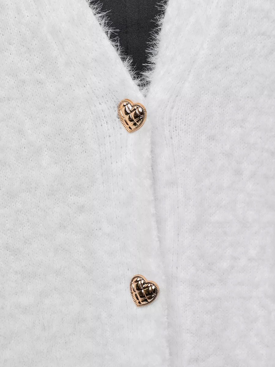 Fuzzy V-Neck Cardigan with Heart Buttons in White — close-up of the heart-shaped buttons
