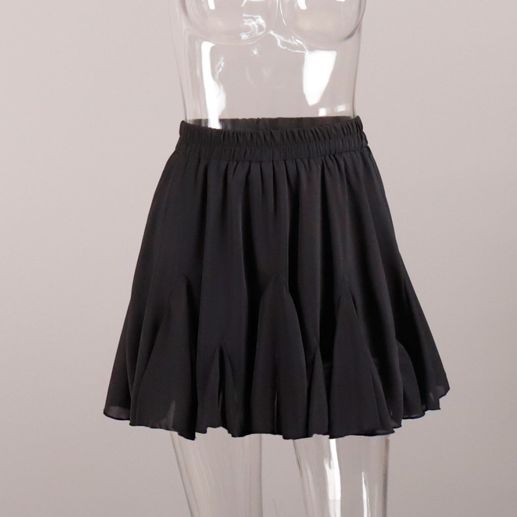 Pleated Bubble Mini Skirt in Black — front view on mannequin