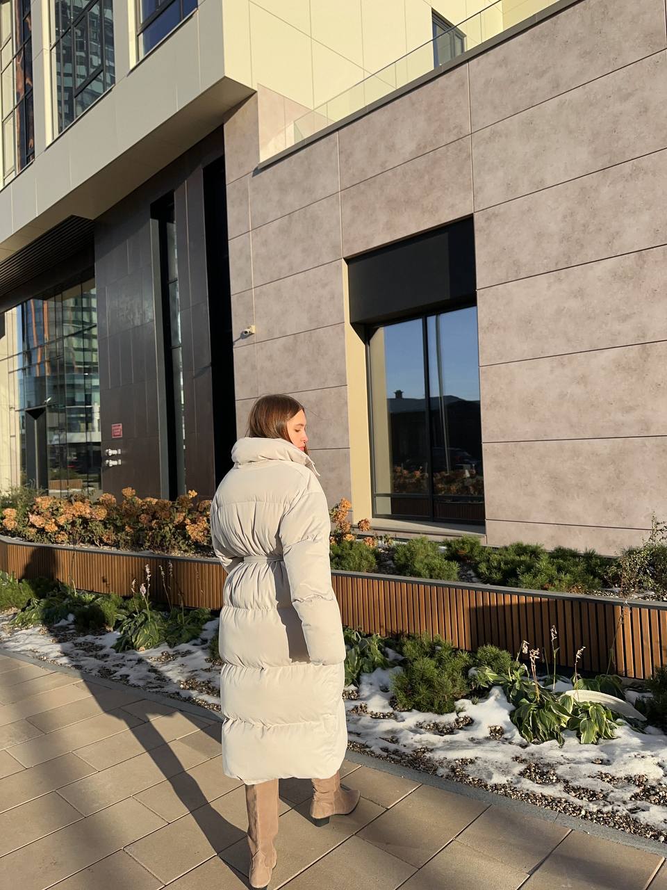 Long Hooded Puffer Coat with Tie Belt in Ivory — back view