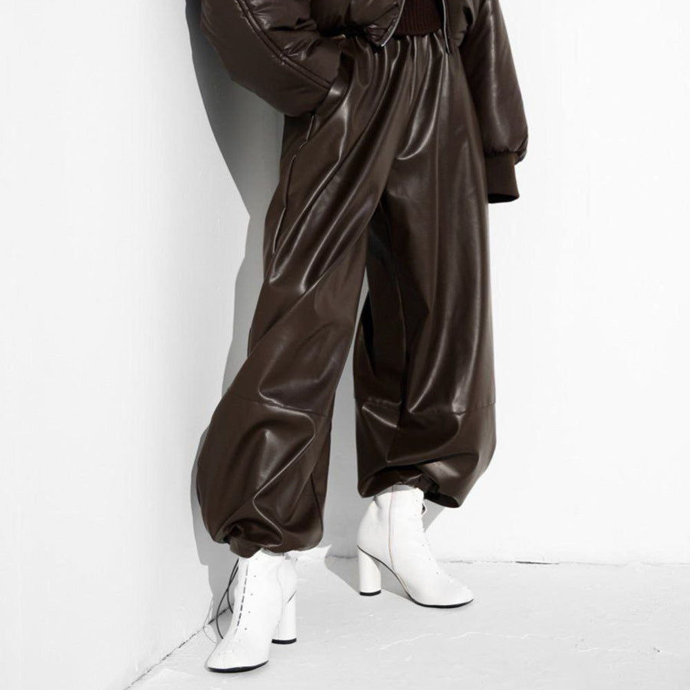 Faux Leather Balloon Pants with Drawstring Ankles in Dark Brown — on model with white boots
