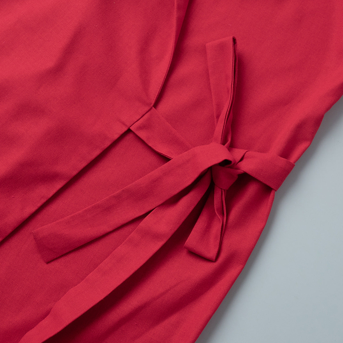 Linen-Blend Long Wrap Duster Dress in Cherry Red — close-up of the waist tie