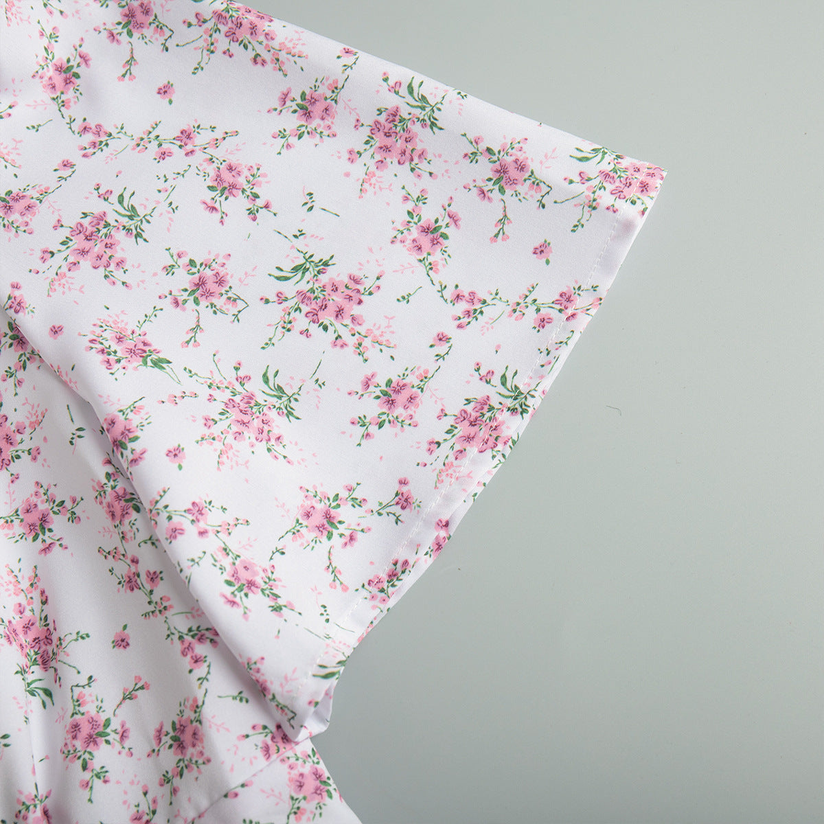 Floral Puff-Sleeve V-Neck Maxi Dress in White Floral — close-up of short sleeve