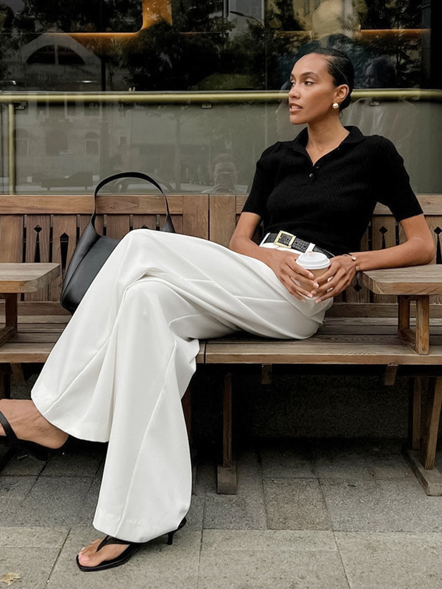 High-Waist Pleated Wide-Leg Trousers in White — on model
