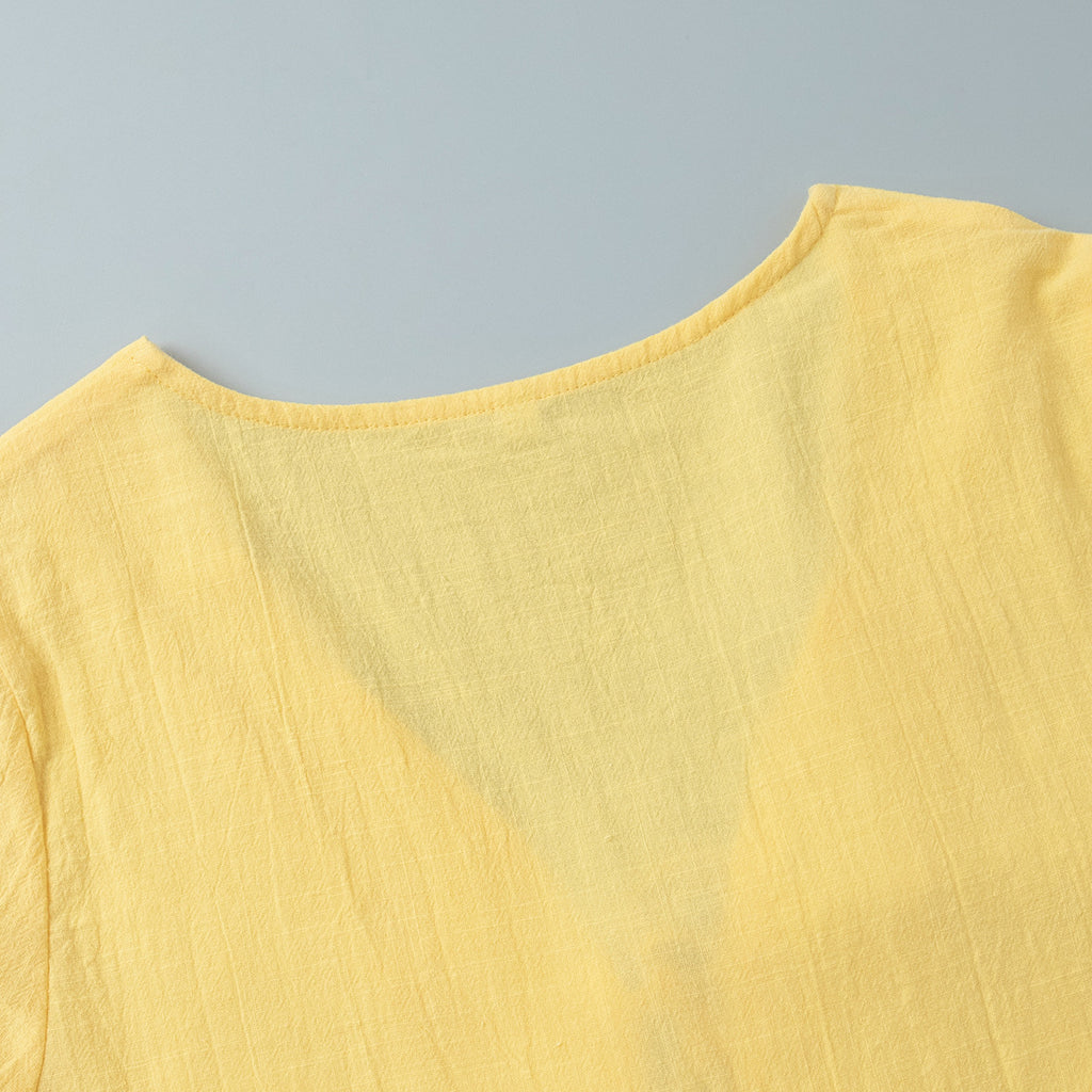 Tie-Front Puff-Sleeve Top & Maxi Skirt Set in Butter Yellow — close-up of the puff sleeve cuff