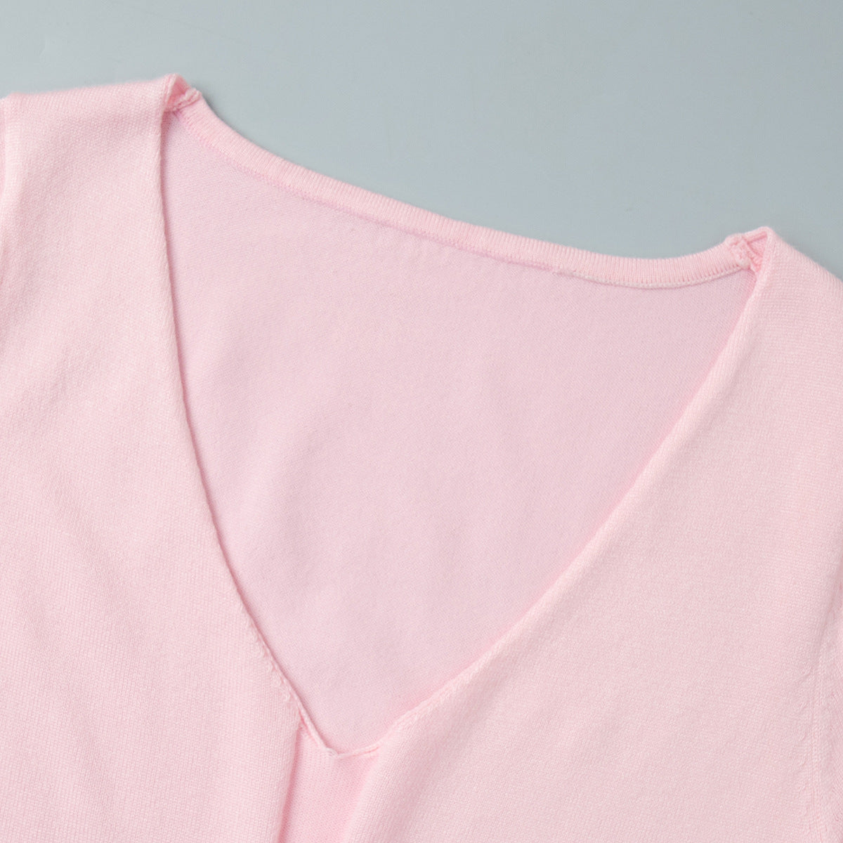 Rib-Knit V-Neck Maxi Dress with Side Slit in Soft Pink — close-up of the V-neck
