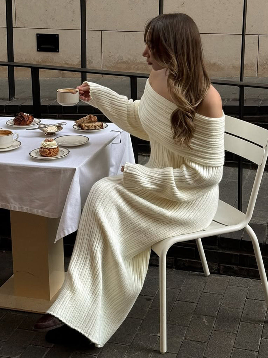 Off-Shoulder Fold-Over Collar Ribbed Knit Maxi Dress in Ivory — full-length seated view on model
