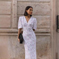 Floral Puff-Sleeve V-Neck Maxi Dress in White Floral — front view on model