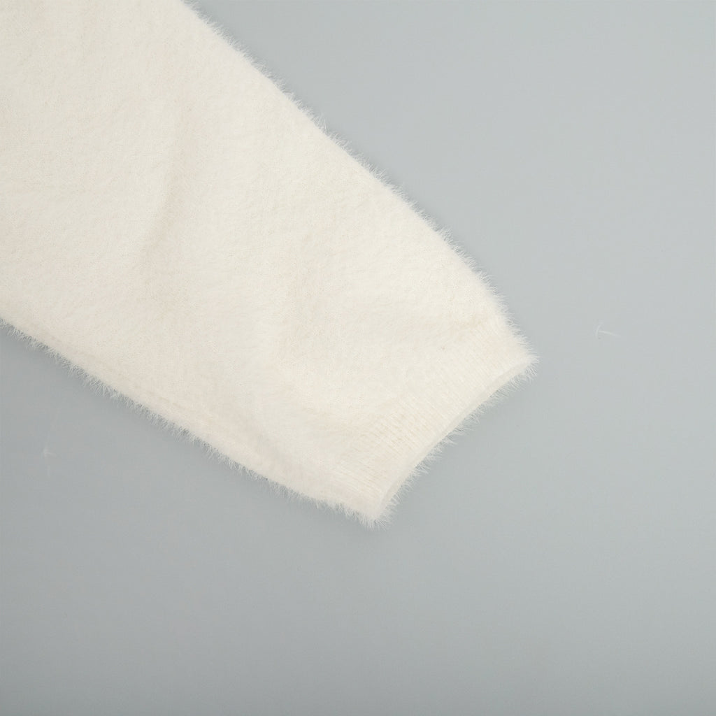 Soft Fuzzy V-Neck Sweater & Knit Maxi Skirt Set in Ivory — close-up of the cuff