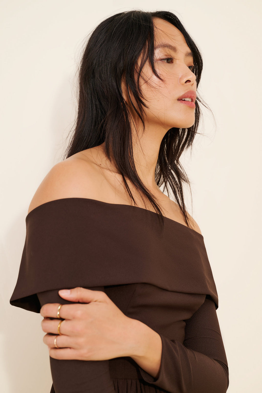 Off-the-Shoulder Long Sleeve Pleated Midi Dress in Chocolate — close-up of the neckline and sleeve