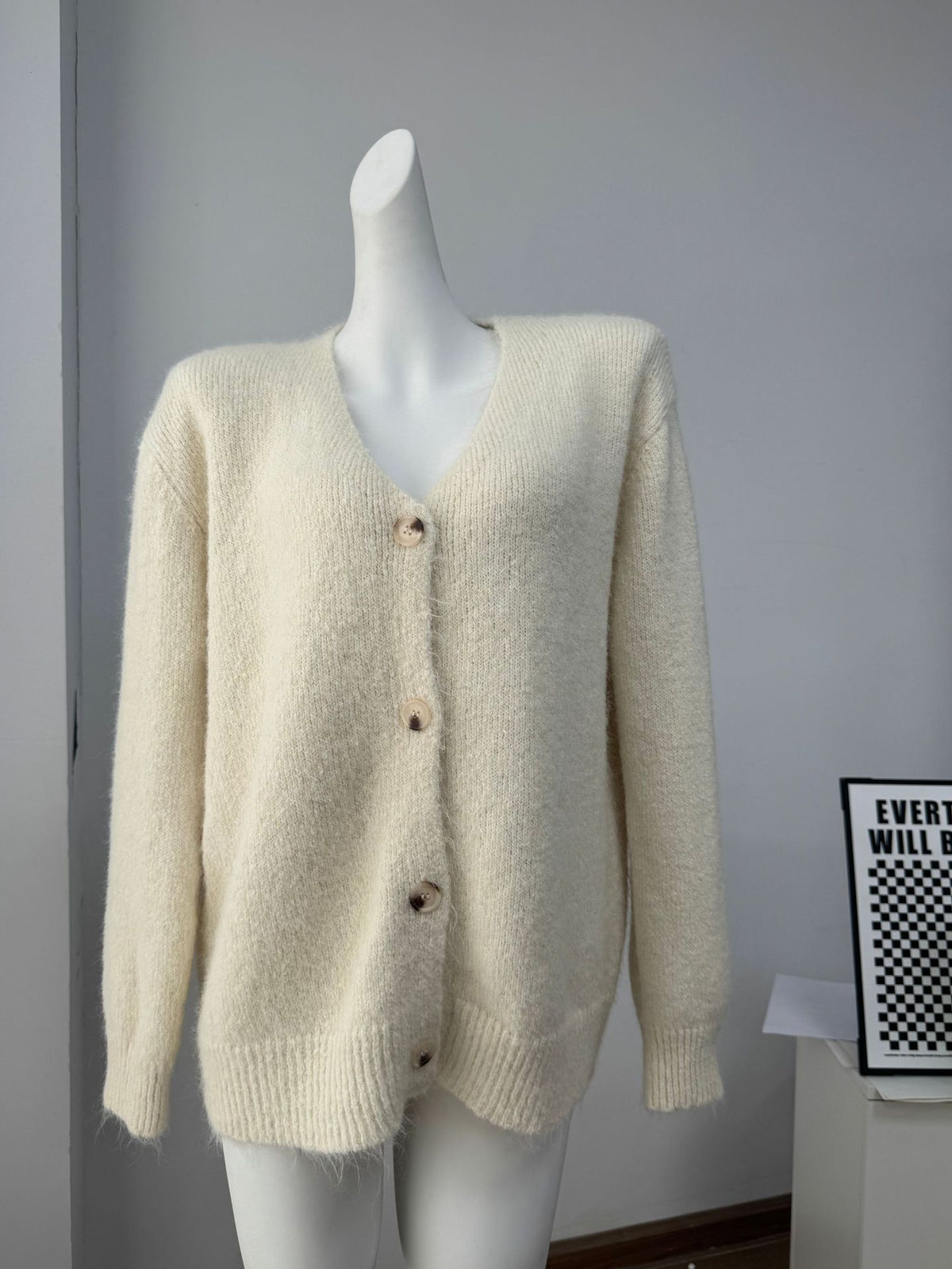 Fuzzy Wool-Blend V-Neck Button Cardigan in Ivory — front view on a dress form