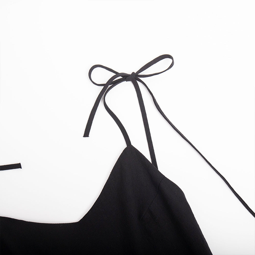 Tie-Shoulder Open-Back Cotton Mini Dress in Black — close-up of shoulder bows