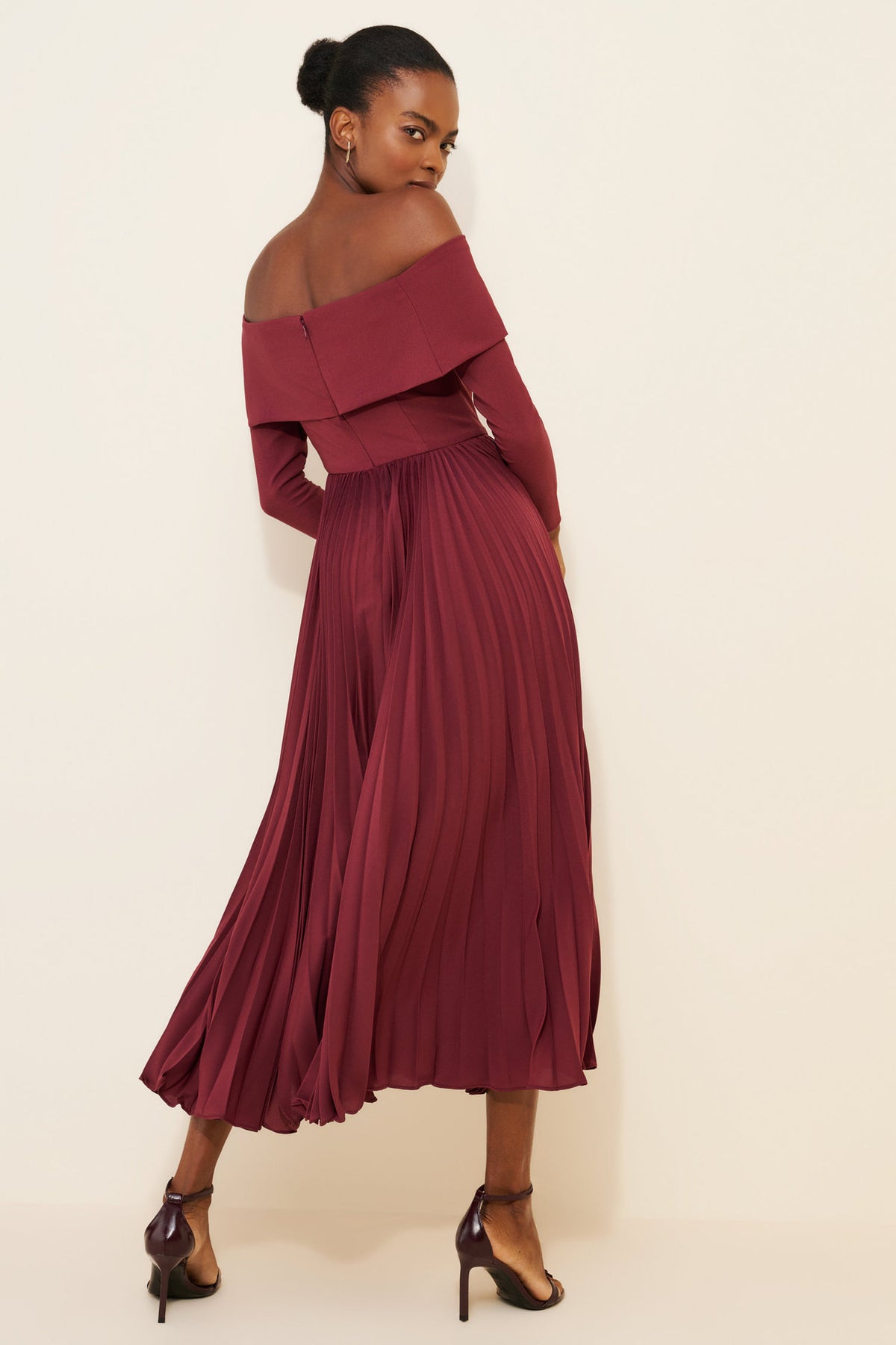 Off-the-Shoulder Long Sleeve Pleated Midi Dress in Burgundy — back view on model